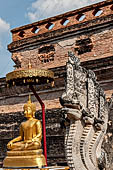 Chiang Mai - The Wat Chedi Luang. The massive chedi heavily damaged by an earthquake. The four staircases are protected by recentely restored guardian naga. 